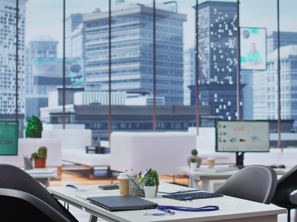 Empty well equipped business office with computers used in recruitment process, showcasing cv resumes and potential candidates. Human resources department deals with job interviews.