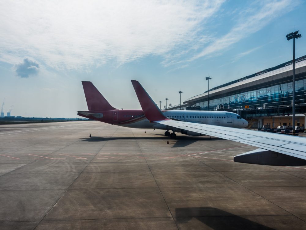 planes on runway in modern airport of China.